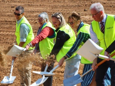 The Cowra Early Childhood Services’ team smiling and digging the first soil at the construction site for the new not-for-profit childcare centre, marking the official start of the build.