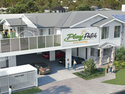 Purpose-built childcare centre exterior with modern façade, secure gated entry, shaded outdoor play areas, and clearly marked parent parking and drop-off zones, representing a professionally planned early learning facility designed for compliance, strong enrolment capacity, and long-term commercial success.