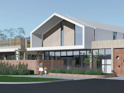 Established childcare centre building with secure entry, branded signage, landscaped outdoor play areas, and dedicated parent parking, representing an operational early learning business and property asset under acquisition review and due diligence assessment.