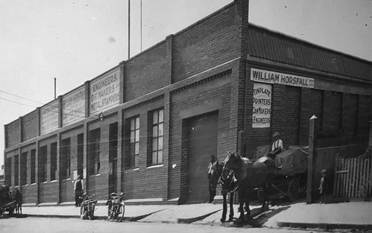 Historic black-and-white photograph of the original William Horsfall warehouse building.