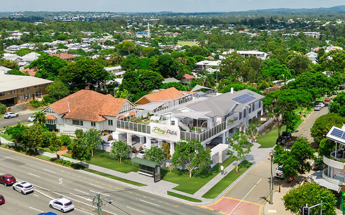 Aerial rendering of Play Patch Early Learning in Annerley at a leafy suburban intersection.