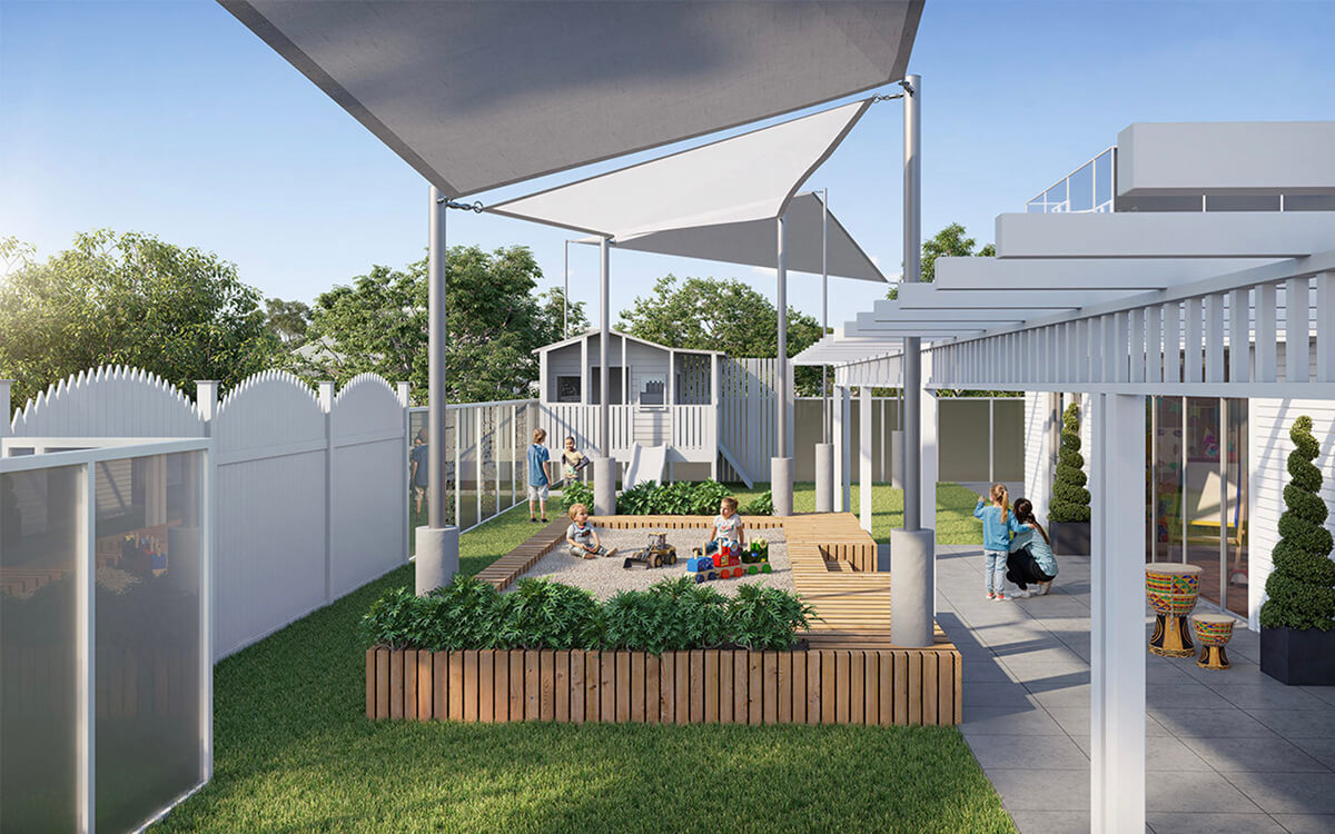 Shaded outdoor learning area at Play Patch Early Learning in Annerley with timber seating and play spaces.