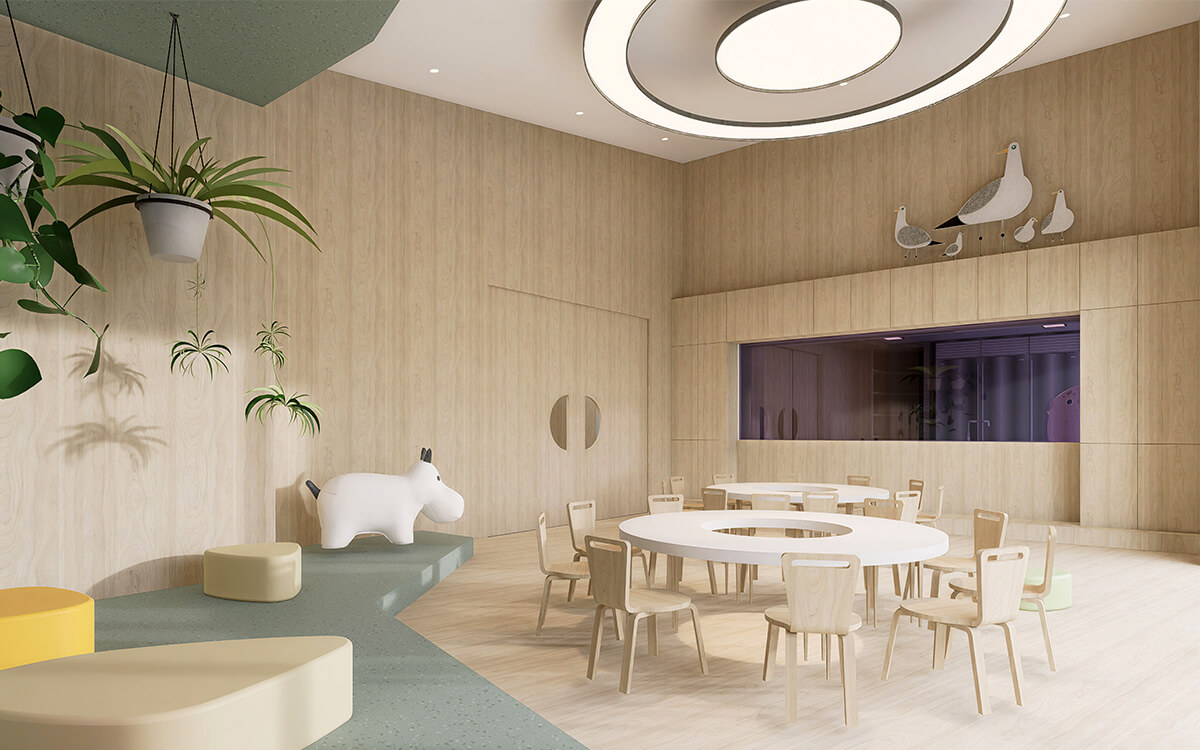 Children's learning area at the CECS Cowra Early Childhood Centre with circular tables and natural timber finishes.