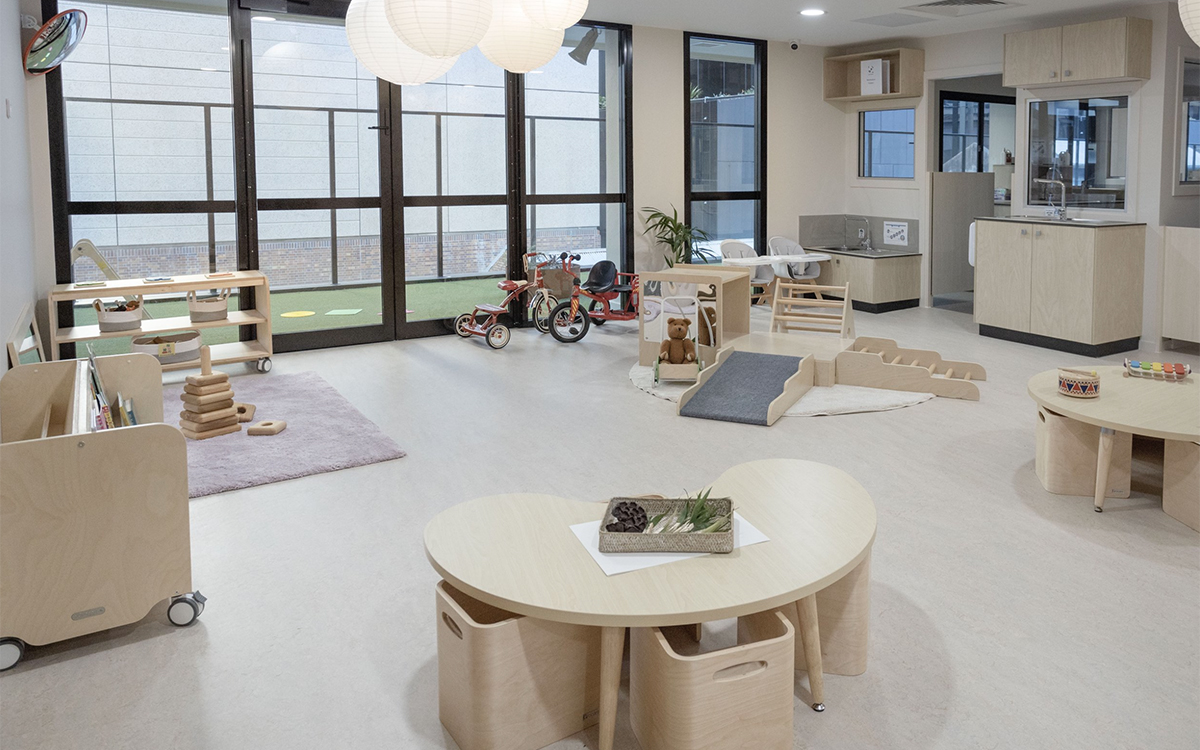 Early learning classroom at HEI Schools with open play spaces, furniture and educational resources.