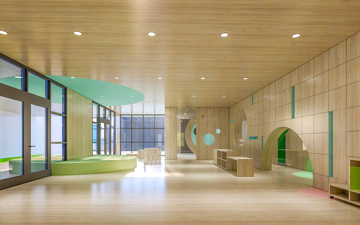 Spacious playroom inside the Bell Street childcare centre featuring natural timber finishes, open learning spaces and children's activity areas.
