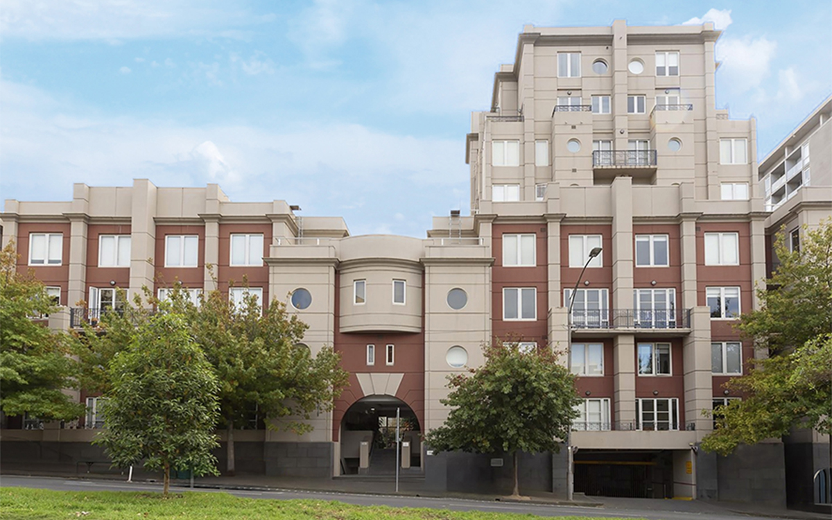 Street view of the Victoria Albert apartment building with landscaped frontage.